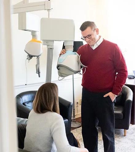 Doctor explaining howTMS Therapy works to depressed patient